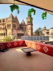 a table in front of a large building at Prag View Heritage Homestay in Bhuj