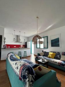 a living room with a couch and a table at Villa Turquesa in Zahora +30 photos