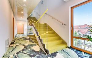 a staircase in a house with a carpet at 2 Bedroom Gorgeous Apartment In Hel in Hel