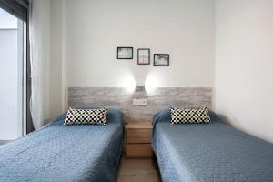 Кровать или кровати в номере Apartamento Coral - Solo familias +17 фотографий