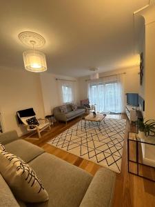 a living room with a couch and a table at BROOK HOUSE 4a in Llangollen