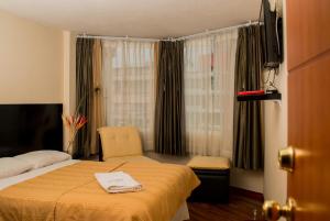 Postel nebo postele na pokoji v ubytování Hostal Capri + 37 fotografií