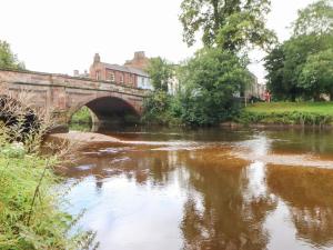 a bridge over a river in a town at Orton in Appleby