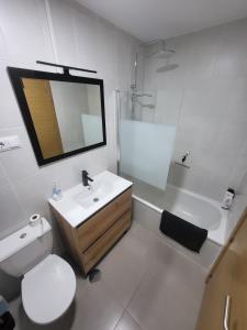 a bathroom with a toilet and a sink and a shower at Golf Las Terrazas de La Torre LRVDM House in Roldán
