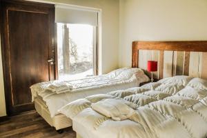 A bed or beds in a room at RentUp - Casa de ensueno para 7 personas en San Martin de los Andes