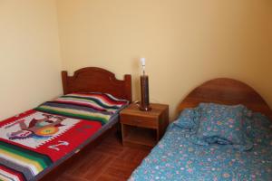 Postel nebo postele na pokoji v ubytování CASA DE DESCANSO VISTA AL MAR