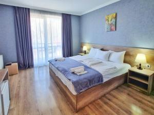 Postelja oz. postelje v sobi nastanitve Sunshine Kazbegi