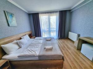 Postelja oz. postelje v sobi nastanitve Sunshine Kazbegi