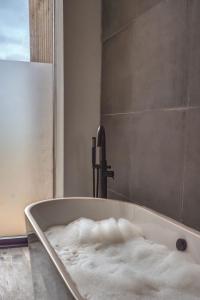 a bath tub filled with snow in a bathroom at Downs in Blewbury