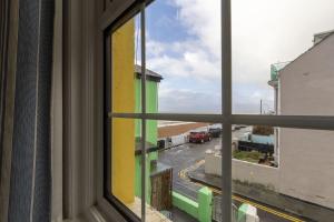 a view of a street from a window at Sea View Cottage, Sandgate in Sandgate