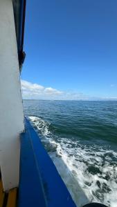 a view of the ocean from the side of a boat at Bela Vista - Casa Beira Mar in Paranaguá