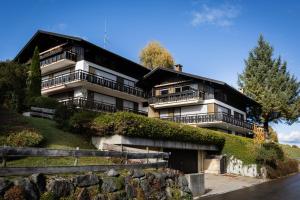 a building on the side of a hill at In der Leite in Oberstdorf