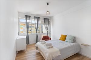 Postel nebo postele na pokoji v ubytování Apartamento Central Peniche