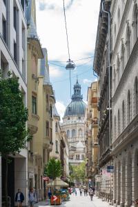 a city street with a building in the distance at Spacious Luxury apartment at the heart of Budapest in Budapest