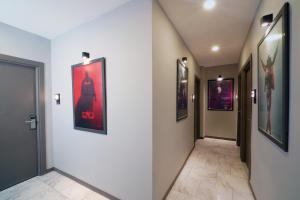a hallway with paintings on the walls of a building at Meet İstanbul Hotel Kadikoy in Istanbul