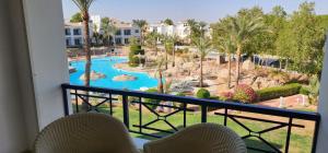 a resort balcony with a view of a pool at First Class at Naama Bay Hotel Appartments in Sharm El Sheikh
