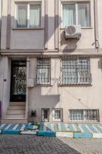 a building with colorful steps in front of a door at City Hall Apart Hotel Sultanahmet in Istanbul