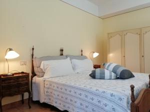 Ένα ή περισσότερα κρεβάτια σε δωμάτιο στο BB Villa Bolgheri Mare
