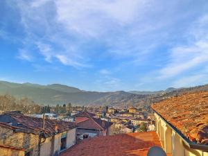 a view of a city with mountains in the background at * Apartment in Barga Old Town with amazing views in Barga