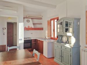 a kitchen with a table and a counter top at * Apartment in Barga Old Town with amazing views in Barga