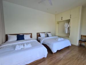 Llit o llits en una habitació de Lang Chai Beachfront Villa Phan Thiet