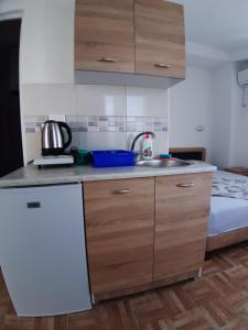 a kitchen with a sink and a counter top at Apartments Snezana in Bar