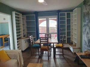 a dining room with a table and chairs at Les Fauvettes in Saint-Paul