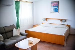 Ένα ή περισσότερα κρεβάτια σε δωμάτιο στο Apartman Marija