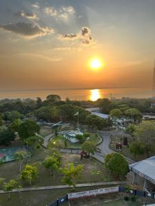 a view of a park at sunset at Vista Rio - A vista é Incrível in Manaus