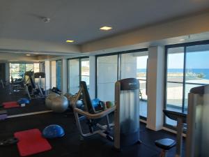 a gym with cardio equipment in a hotel room at Marina towers in Herzliya