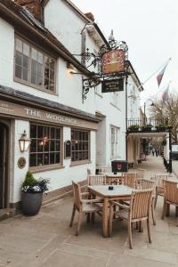 a table and chairs in front of a building at The Woolpack Hotel in Tenterden