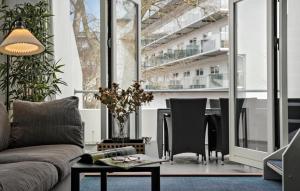 a living room with a couch and a table at 1 Bedroom Beautiful Home In Helsingør in Helsingør