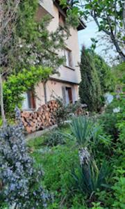 a house in the middle of a garden at Варвара- Ятрус in Varvara