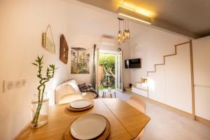 a living room with a table and a couch at 06Y1 - Beautiful modern T2 with terrace Juan-les-Pins in Juan-les-Pins