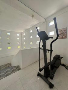 a room with a exercise bike in a room at D'Flora Homestay in Labuan Bajo