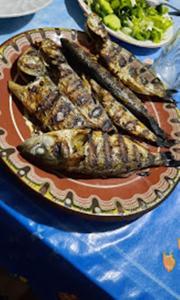 a plate of food on a table with a plate of food at Варвара- Ятрус in Varvara