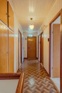an empty hallway in an office building with a door at The Cookie Store Guesthouse in Tórshavn