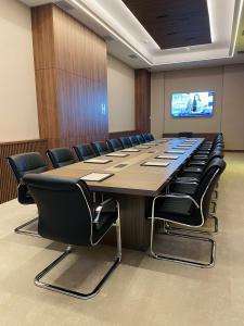 a large conference room with a long table and chairs at Hotel City Savoy in Belgrade