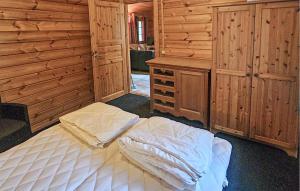 a bedroom with a bed and a desk in it at Lovely Home In Neede With Sauna in Neede