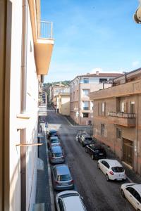 a street with cars parked on the side of a building at Casita Jolanda in Albano Laziale
