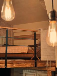 a bunk bed in a room with two lights at Boutique Guest House Yes For You in Plovdiv