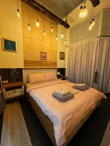 Ένα ή περισσότερα κρεβάτια σε δωμάτιο στο Boutique Guest House Yes For You