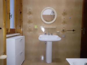a bathroom with a white sink and a mirror at AFRODITE in Porto Cesareo +127 photos