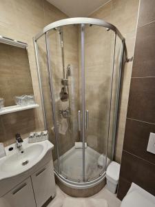 a bathroom with a shower and a toilet and a sink at Split/Podstrana Apartment ADRIA in Podstrana +55 photos