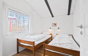 Postel nebo postele na pokoji v ubytování Holiday Home Nøddehaven Iii