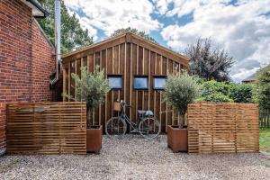 a bicycle parked in front of a building at Little Dove, Orford in Woodbridge