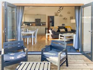 a living room with a couch and a table and chairs at Woodside Retreat, Number 37 in Worthington