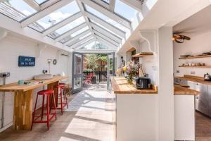 an extension to a kitchen with a skylight at Dove Point, Orford in Woodbridge