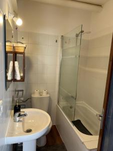 a bathroom with a sink and a shower and a toilet at Le Mirage Ibiza in San Antonio +43 photos