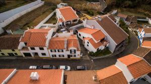 an overhead view of a group of houses with roofs at WelcomeBuddy - Casa da Praia - Moinhos Beach in Porto Formoso